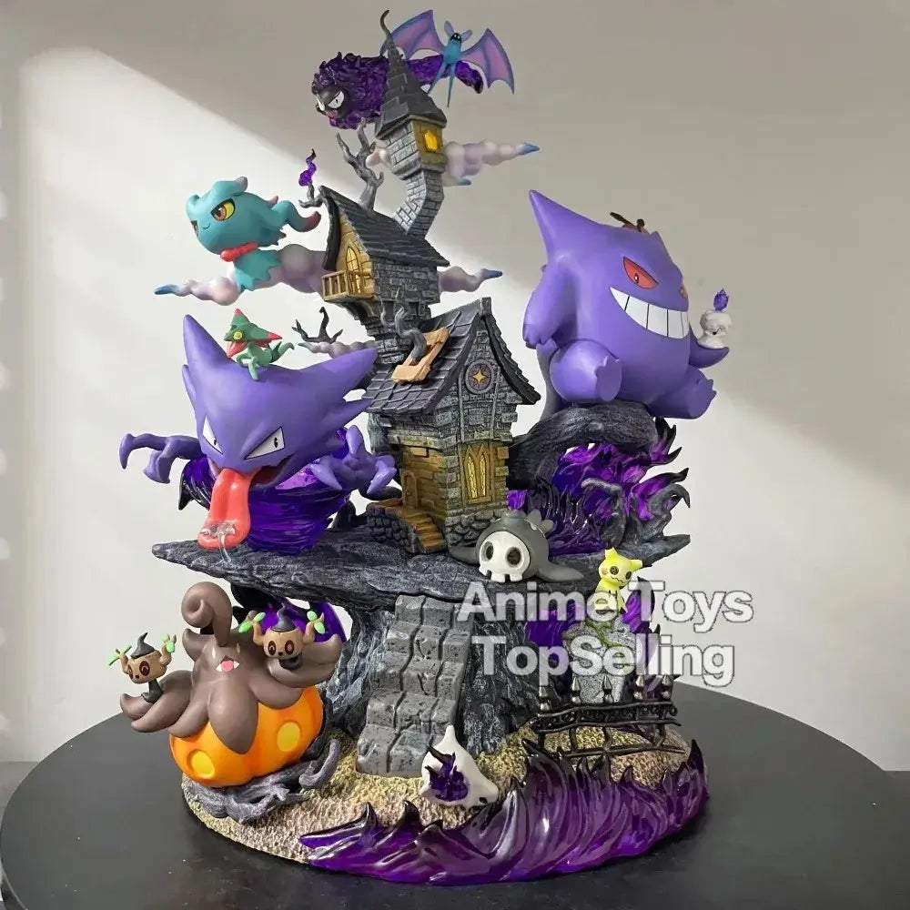 Gengar Pokemon figure collectible displayed with other ghost-type Pokémon on a decorative haunted house base.