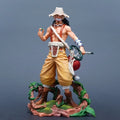 One Piece Usopp action figure 25cm standing on a detailed base, holding an item in hand and wearing his signature hat.