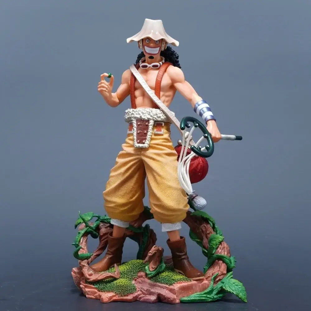 One Piece Usopp action figure 25cm standing on a detailed base, holding an item in hand and wearing his signature hat.