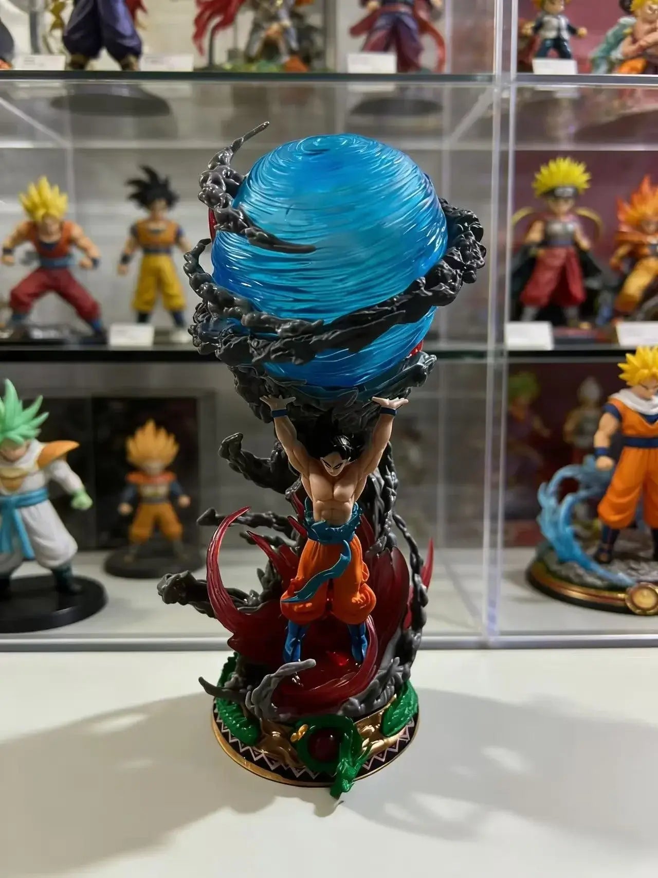 Goku Dragon Ball PVC figure showcasing dynamic pose and detailed base with swirling energy effect.