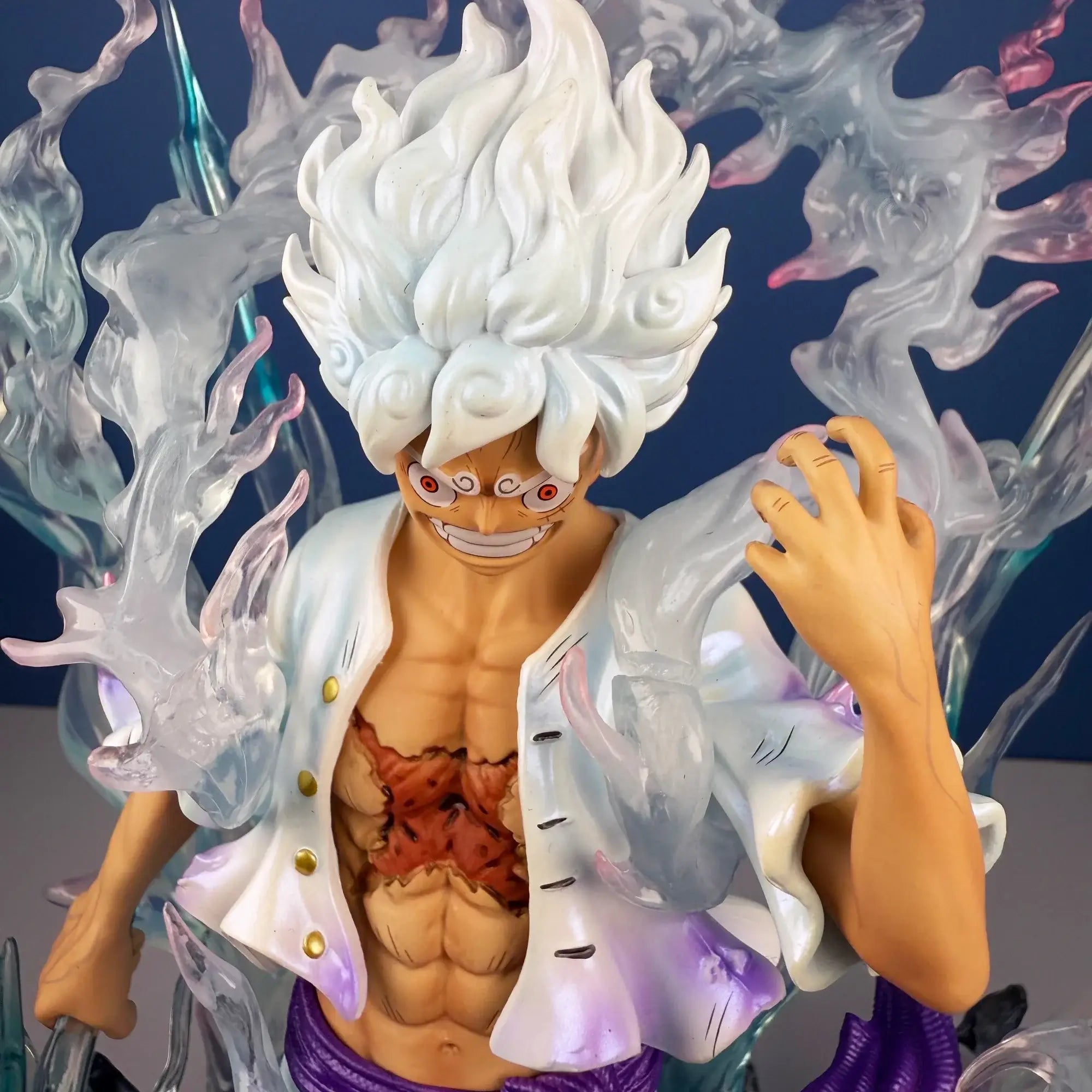Nika Luffy One Piece action figure standing against a smoky background, showcasing detailed features and vibrant colors.