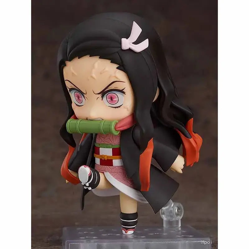 Nendoroid Kamado Nezuko 1194 action figure with pink eyes and bamboo, showcasing dynamic pose and detailed design.