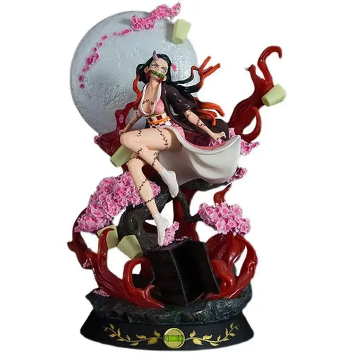 Demon Slayer Kamado Nezuko Action Figure showcasing intricate details with pink flowers and a full moon background.