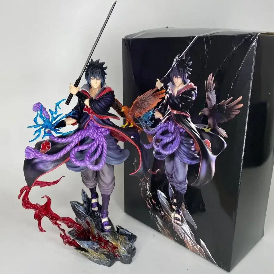 Sasuke Uchiha Naruto Action Figure 30cm with detailed features and vibrant colors displayed next to its packaging.