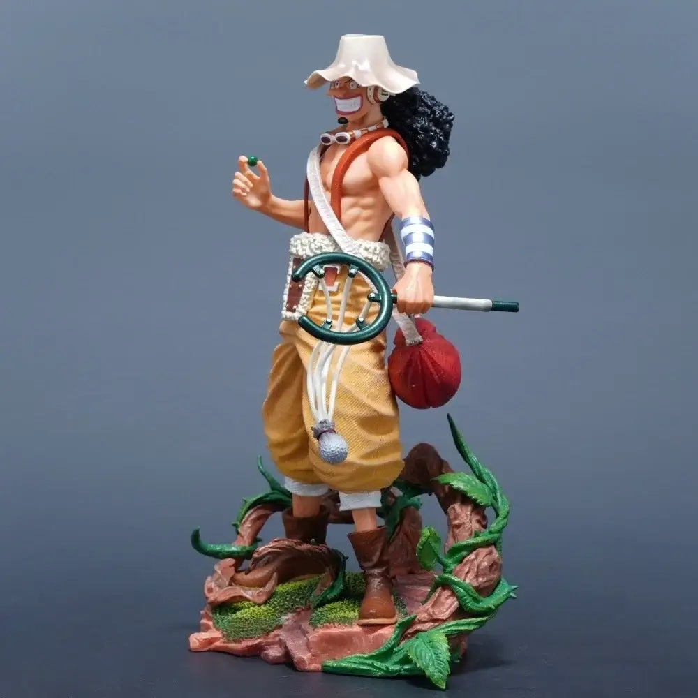 One Piece Usopp action figure 25cm standing on a base with detailed vegetation, showcasing vibrant colors and dynamic pose.