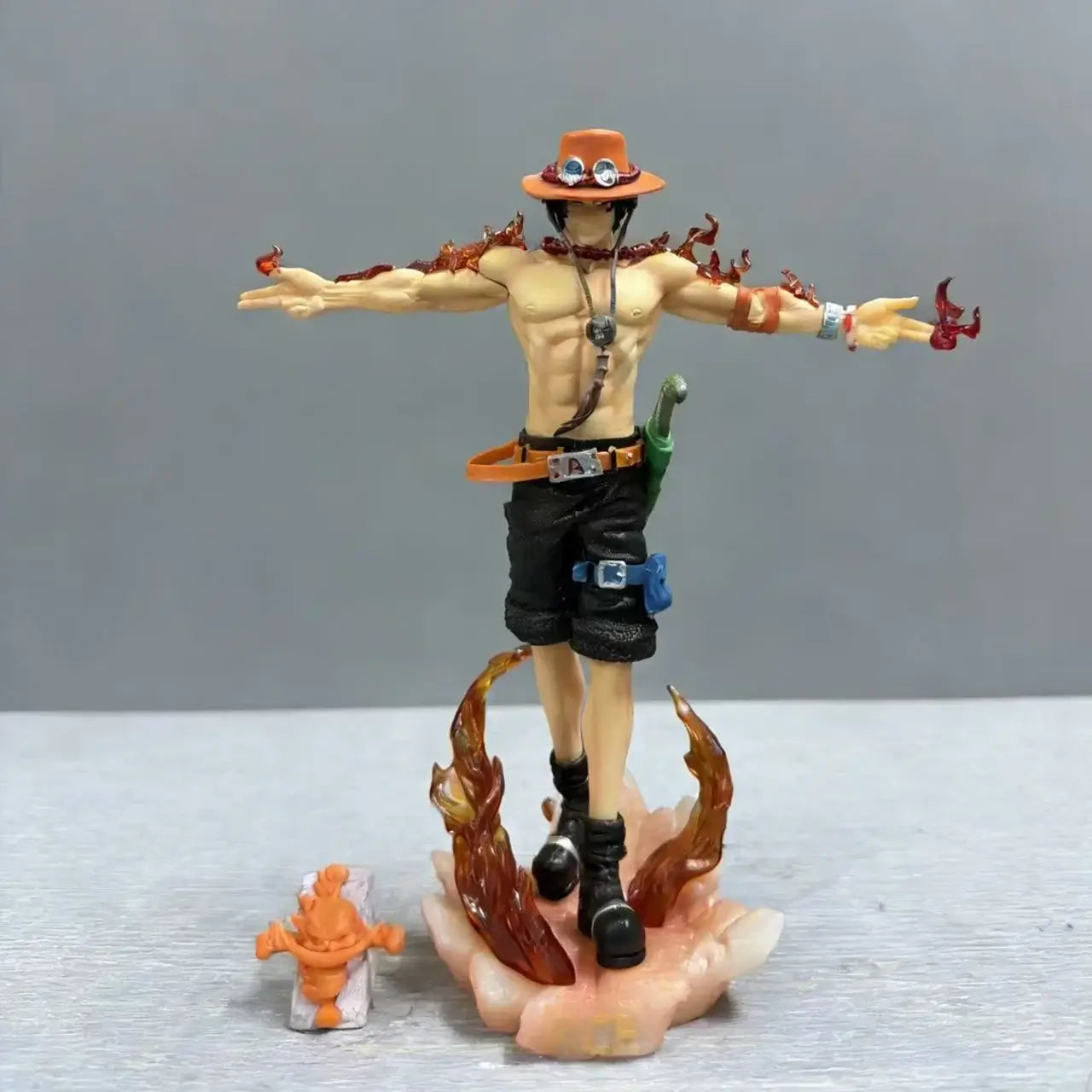 28cm Portgas D Ace action figure in dynamic pose with flames and small accessory figure.